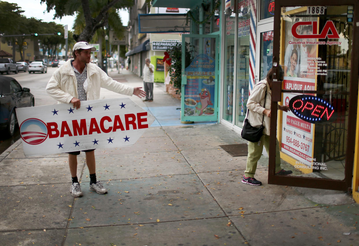MIAMI, FL - FEBRUARY 05:  Pedro Rojas holds a sign directing people to an insurance company where they can sign up for the Affordable Care Act, also known as Obamacare, before the February 15th deadline on February 5, 2015 in Miami, Florida. Numbers released by the government show that the Miami-Fort Lauderdale-West Palm Beach metropolitan area has signed up 637,514 consumers so far since open enrollment began on Nov. 15, which is more than twice as many as the next largest metropolitan area, Atlanta, Georgia.  (Photo by Joe Raedle/Getty Images)