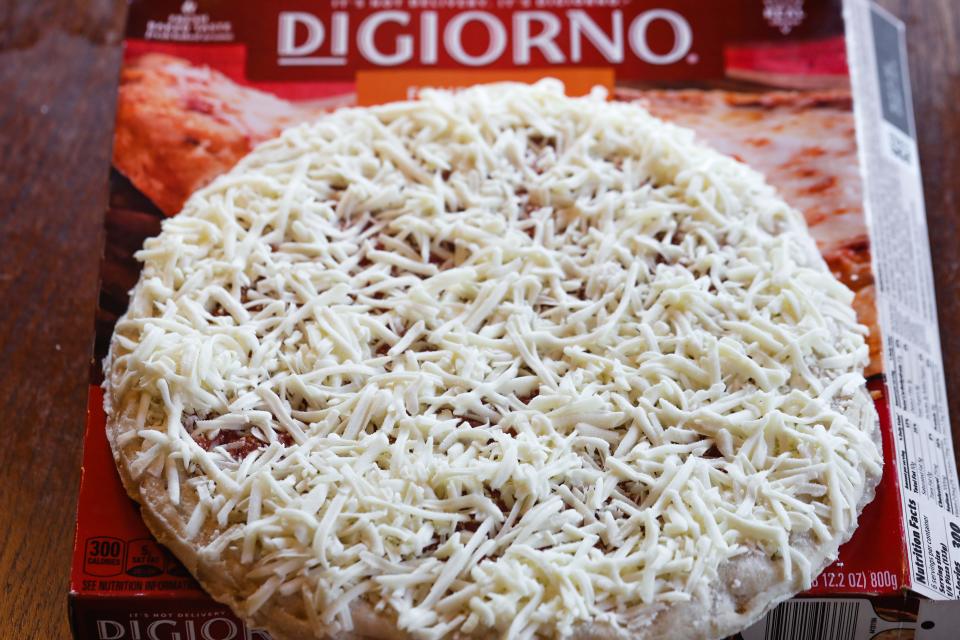 uncooked DiGiornio pizza on box