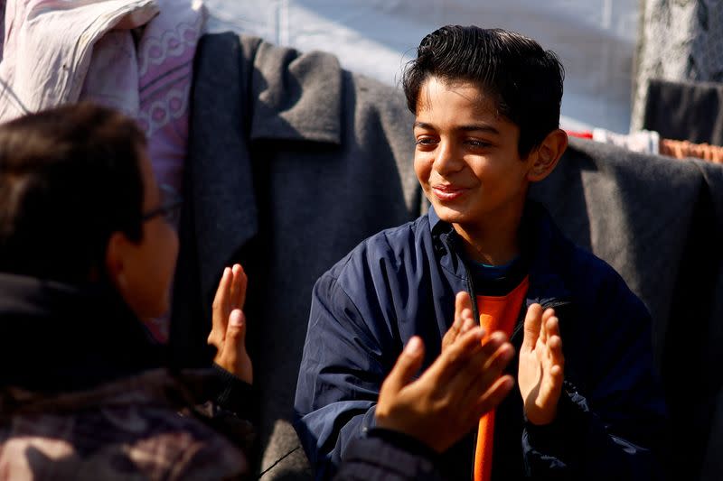 Displaced 'Gaza Newton' lights up his tent with wind energy amid power cut