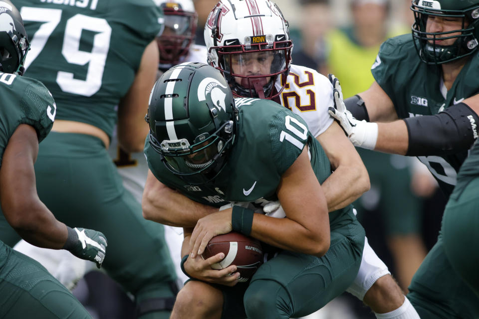 Michigan State quarterback Payton Thorne (10) is sacked by Minnesota's Ryan Stapp (22) during the first quarter of an NCAA college football game, Saturday, Sept. 24, 2022, in East Lansing, Mich. (AP Photo/Al Goldis)