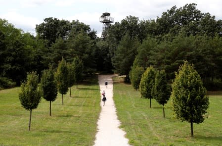 People walk at the Pan-European Picnic Memorial Park in Sopronkohida