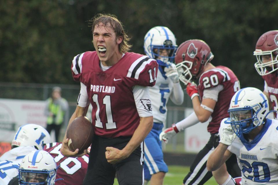 Portland junior quarterback Dominic Novara (No. 11) celebrates a touchdown against Ionia during a varsity football game Friday, Sept. 8, at Portland High School. Portland won the game, 42-6.