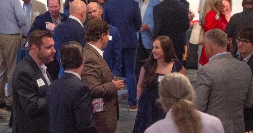 Tate Reeves’ supporters mingle as they wait for the arrival of the governor at his watch party at the Old Capitol Inn in Jackson, Miss., Tuesday, Aug. 8, 2023.