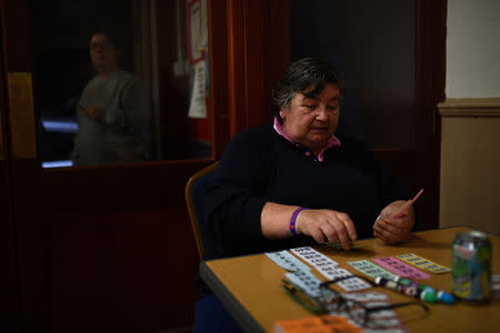 Evelyn Ovington, 59, who voted to leave the EU, plays Bingo at Coronation Hall in Skegness, Britain March 3, 2019. "Get us out of there and get us our own nation back. That's what I say," said Evelyn. "(I'm) just fed up with all the money that they give to the EU when we can spend it here. I want out." REUTERS/Clodagh Kilcoyne