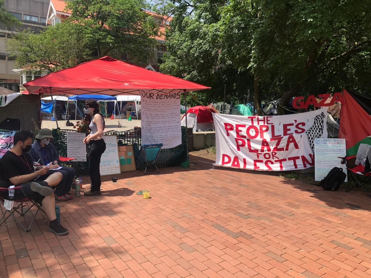 People who are part of the People’s Plaza for Palestine encampment at the University of Guelph in southern Ontario say they will leave by July 15. The university says it will pause taking any legal action until then. (Karis Mapp/CBC - image credit)