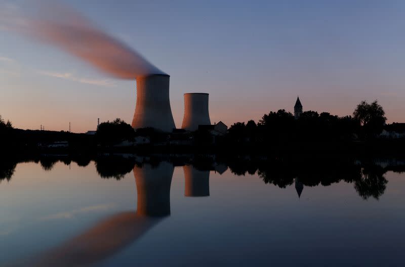 FILE PHOTO: Steam rises from a cooling tower of the Electricite de France (EDF) nuclear power station in Civaux
