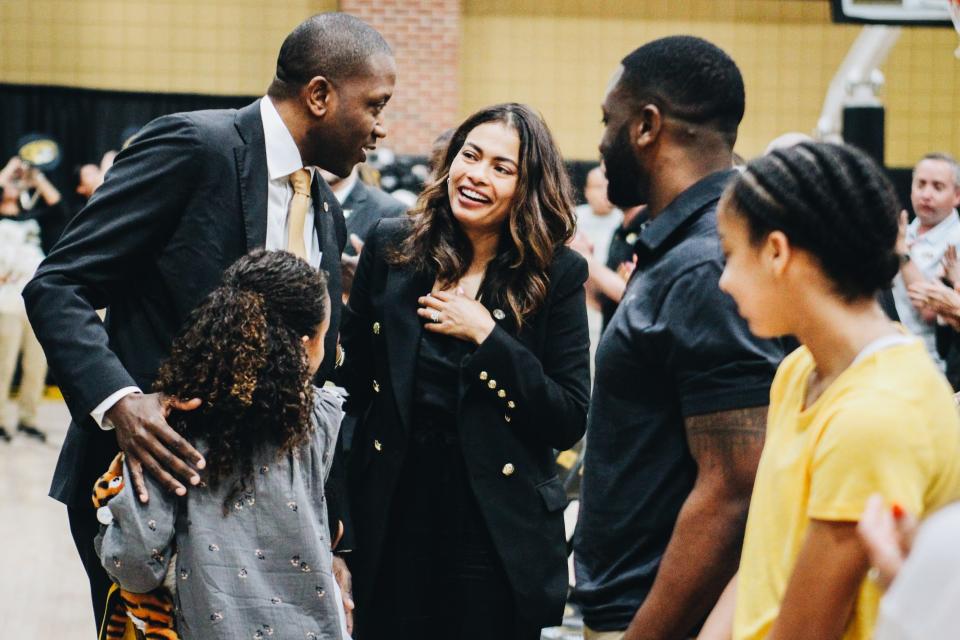 Dennis Gates takes a moment with his family after his introduction as Missouri's 20th head men's basketball coach at the Albrecht Family Practice Facility inside Mizzou Arena.
