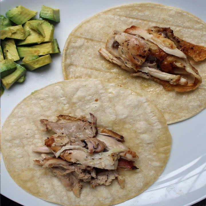 Two tortillas topped with chicken