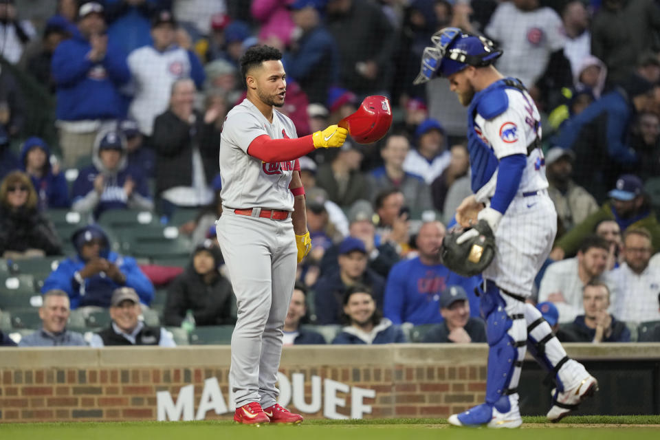 St. Louis Cardinals' Willson Contreras tips his batting helmet towards Chicago Cubs catcher Tucker Barnhart during the second inning of a baseball game on Monday, May 8, 2023, in Chicago. (AP Photo/Charles Rex Arbogast)