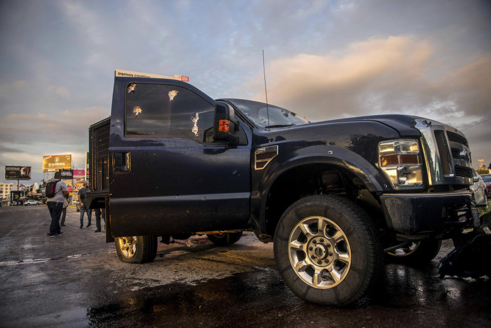 A truck's windows shows hits from bullets after a gunfight in Culiacan, Mexico, Thursday, Oct. 17, 2019. An intense gunfight with heavy weapons and burning vehicles blocking roads raged in the capital of Mexico’s Sinaloa state Thursday after security forces located one of Joaquín “El Chapo” Guzmán’s sons who is wanted in the U.S. on drug trafficking charges. (AP Photo/Hector Parra)