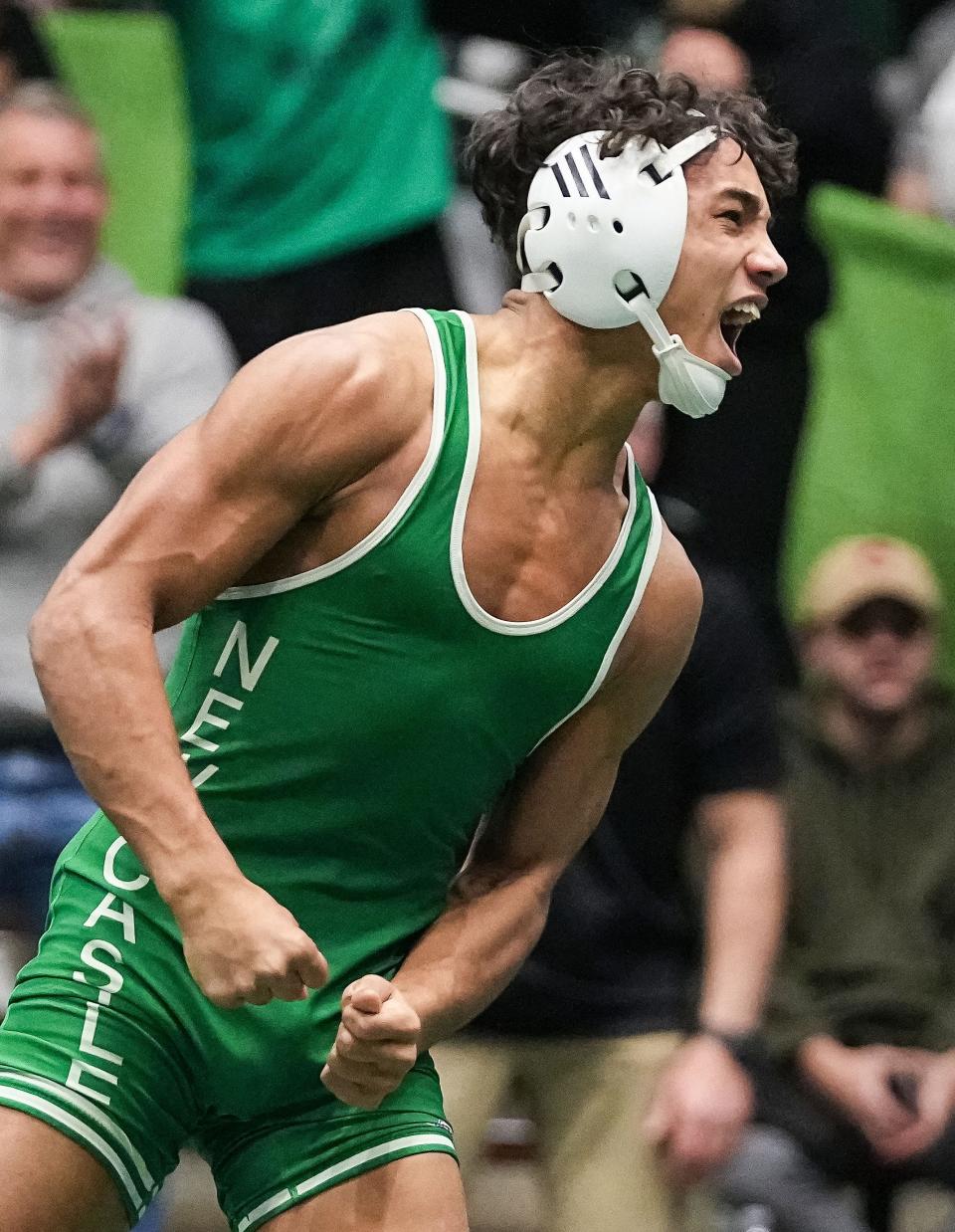 New Castle Tylin Thrine yells in excitement after defeating Cathedral Jesus Aquino-Morales during the IHSAA wrestling semi-state on Saturday, Feb. 11, 2023 at New Castle Fieldhouse in New Castle.