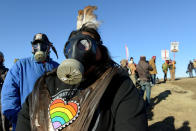 <p>People wear gas masks next to the pipeline route during a protest against the Dakota Access pipeline near the Standing Rock Indian Reservation in St. Anthony, North Dakota, U.S. November 11, 2016. (Photo: Stephanie Keith/Reuters) </p>