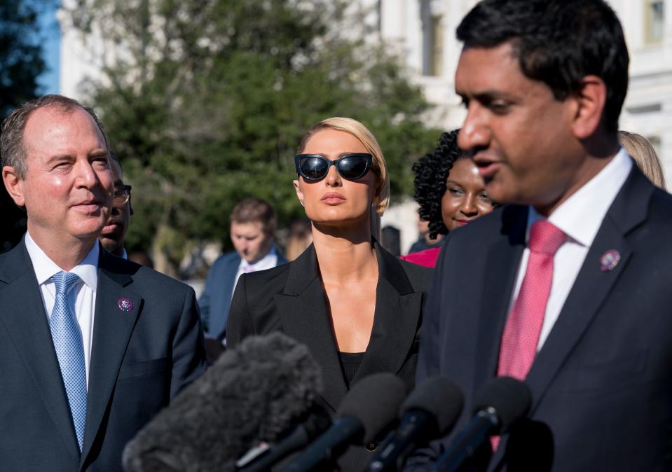 Hotel heiress and reality star Paris Hilton, flanked by House Intelligence Committee Chairman Adam Schiff, D-Calif., left, and Rep. Ro Khanna, D-Calif., lends her celebrity to support legislation to establish a bill of rights for children placed in congregate care facilities, at the Capitol on Wednesday, Oct. 20, 2021. Hilton says she was traumatized as a teenager when she was sent by her family to abusive care facilities. (AP Photo/J. Scott Applewhite)