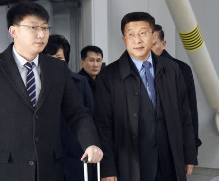 Kim Hyok Chol (R), North Korea's interlocutor leading negotiations with the United States, is pictured upon arrival at Beijing's international airport on his way to the Vietnamese capital Hanoi, in Beijing, China in this photo taken by Kyodo February 19, 2019.Picture taken February 19, 2019. Kyodo via REUTERS