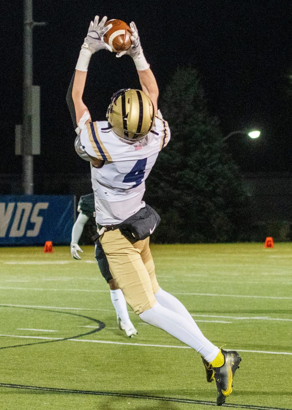 St. Bernard’s Quinn Carlson intercepts a St. Paul pass in the second quarter.