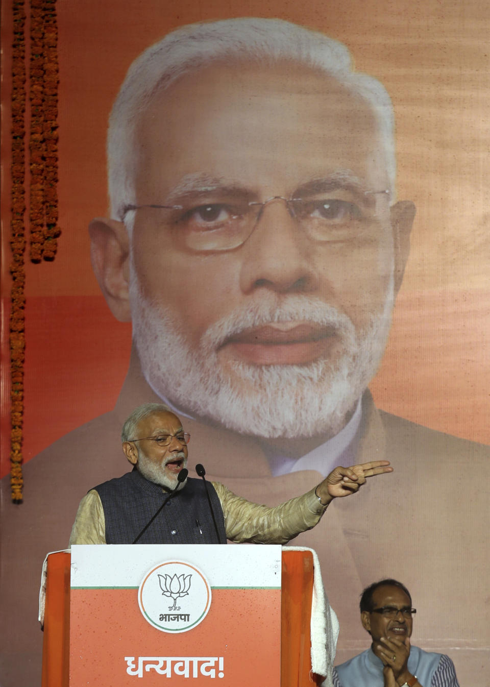 In this Thursday, May 23, 2019 photo, Indian Prime Minister Narendra Modi addresses supporters at the Bharatiya Janata Party (BJP) headquarters in New Delhi, India. Modi’s vision of India is threefold, political analysts say: getting India into the exclusive $5 trillion economy club that includes the European Union, United States, China and Japan; asserting itself as a nuclear power and a force in the world; and placing its Hindu heritage at the center of politics. (AP Photo/Manish Swarup)