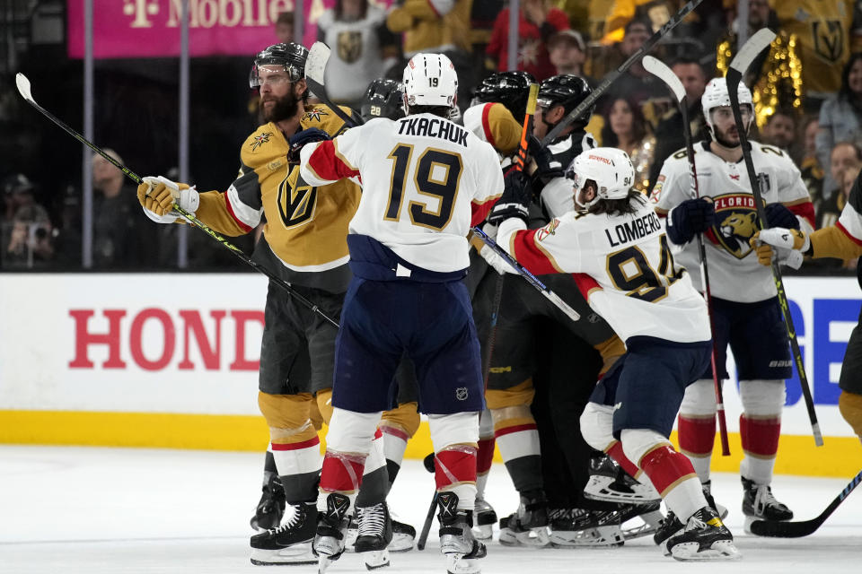 The Vegas Golden Knights and the Florida Panthers fight during the second period of Game 1 of the NHL hockey Stanley Cup Finals, Saturday, June 3, 2023, in Las Vegas. (AP Photo/John Locher)