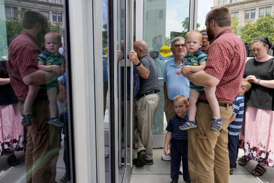 Supporters wait to enter the Fred D. Thompson U.S. Courthouse and federal building for sentencing hearings of three anti-abortion activists, Wednesday, July 3, 2024, in Nashville, Tenn. The activists were convicted in January on felony conspiracy charges for their roles in a 2021 Tennessee clinic blockade appeared before U.S. District Judge Aleta Trauger. (AP Photo/George Walker IV)