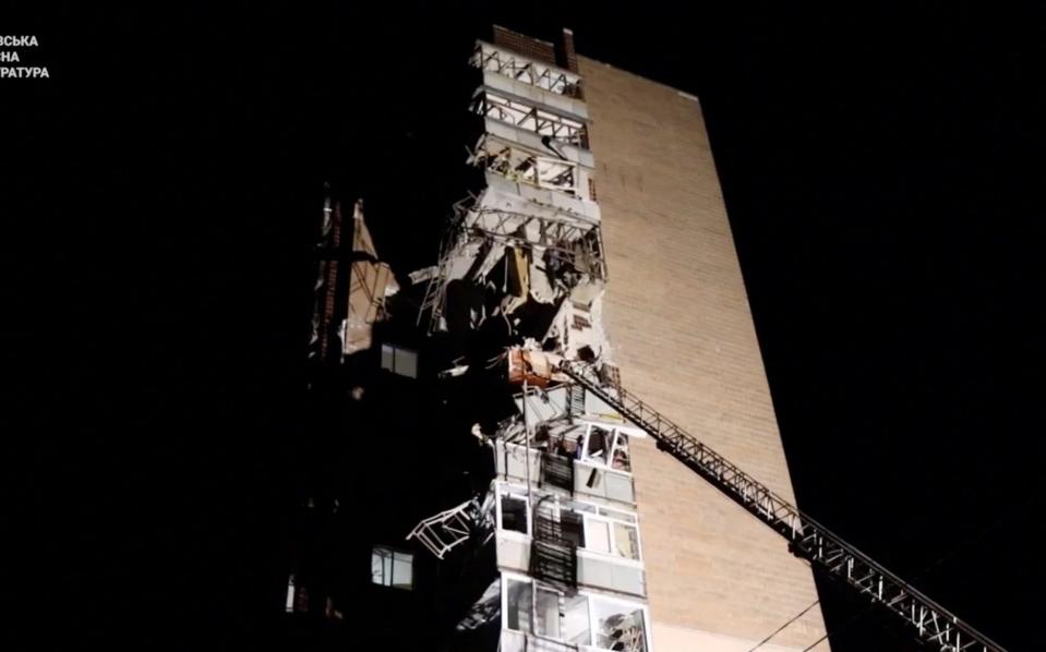 A damaged multi-storey building following a Russian drone attack on a residential area of Kharkiv