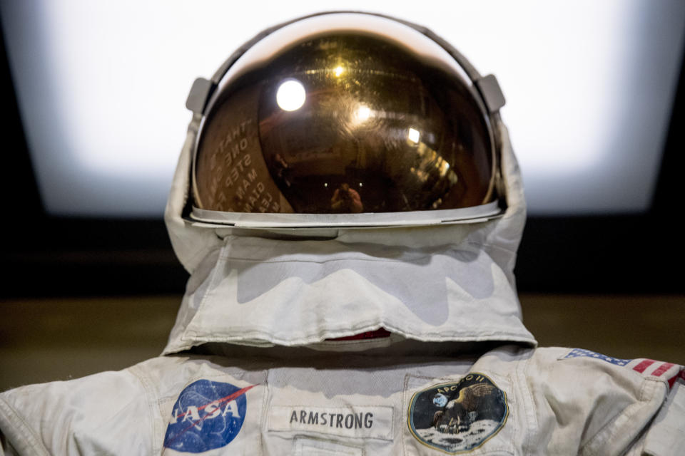 Neil Armstrong's Apollo 11 spacesuit is unveiled at the Smithsonian's National Air and Space Museum on the National Mall in Washington, Tuesday, July 16, 2019. (AP Photo/Andrew Harnik)