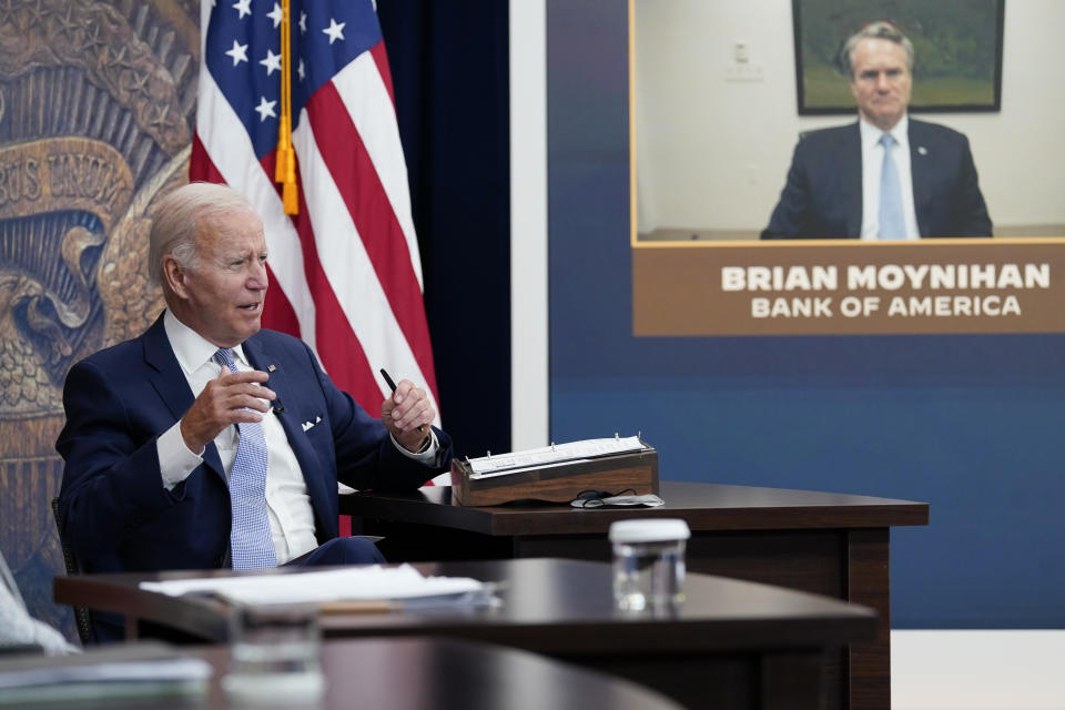 President Joe Biden speaks about the economy during a meeting with CEOs in the South Court Auditorium on the White House complex, Thursday, July 28, 2022.  Bank of America CEO Brian Moynihan appears on screen at right.  (AP Photo/Susan Walsh)