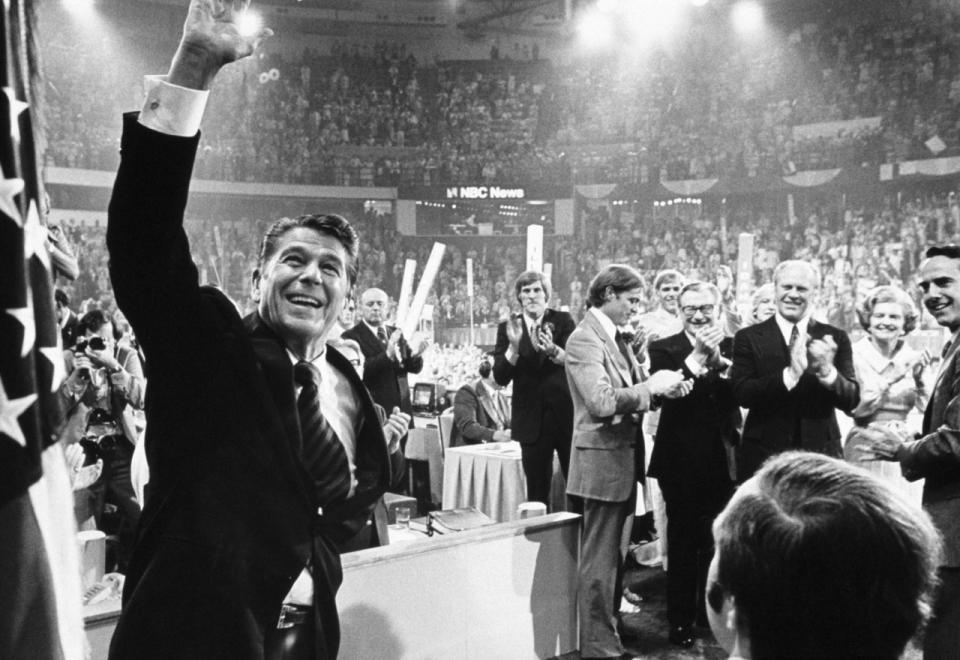 Ronald Reagan waves to the crowd at the 1976 Republican National Convention in Kansas City, Mo. Behind Reagan, from left, stands Gerald Ford's sons, Mike Ford, Jack Ford and Steve Ford; Vice President Nelson Rockefeller; President Gerald Ford; Betty Ford; and vice presidential candidate Bob Dole. (Photo: David Hume Kennerly/Getty Images)