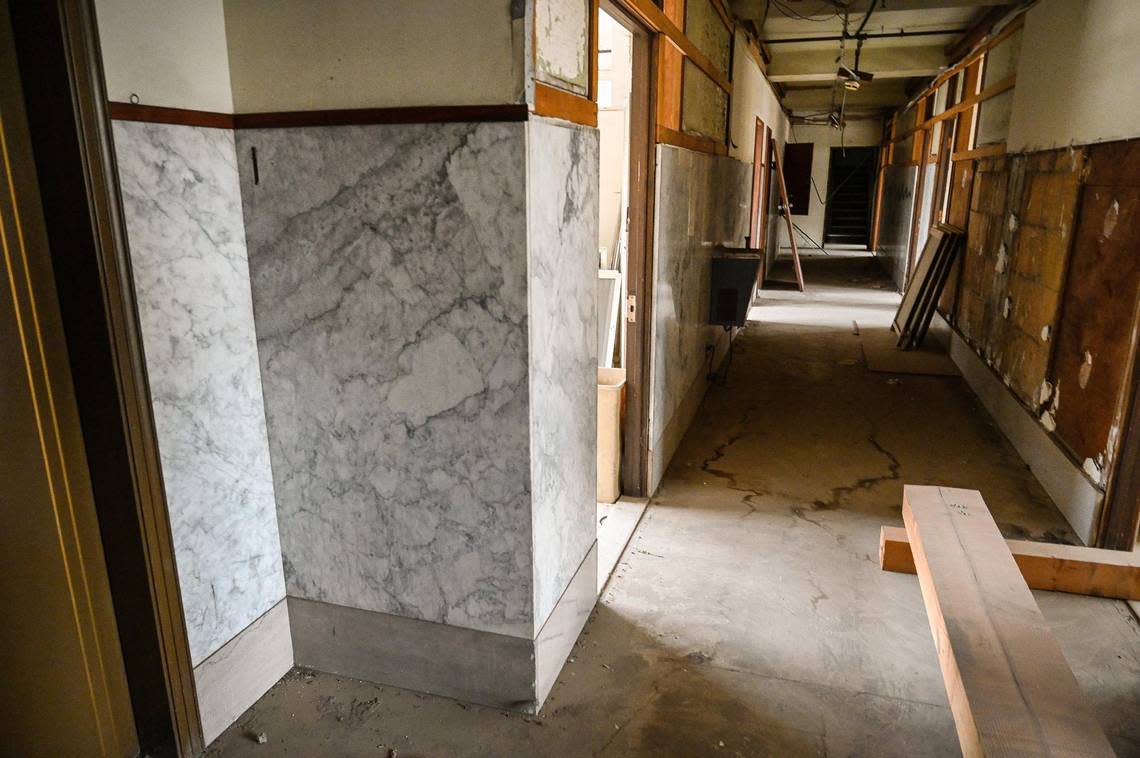 Original marble walls still appear in a hallway of one of the upper floors the Helm Building as seen on a tour on Thursday, Dec. 1, 2022. Sevak Khatchadourian, who has successfully renovated the Pacific Southwest Buildin, is hoping to develop the Helm Building with new micro apartments.