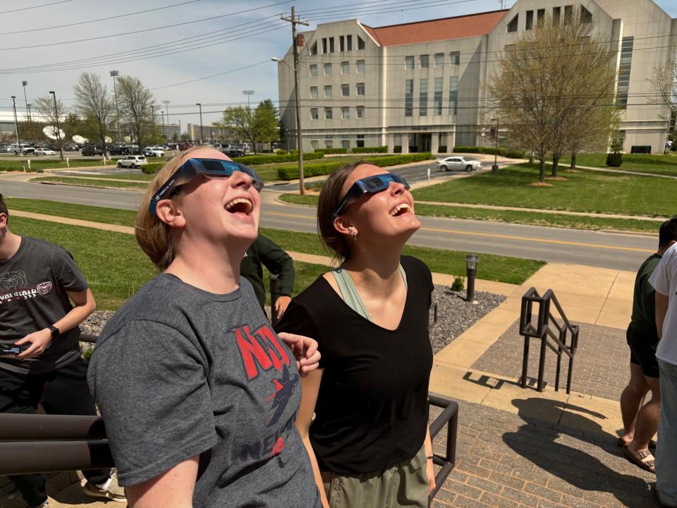 Missouri State University students Kylie Real and Sarah Wood watch the solar eclipse from the Campus Catholic Ministries building on April 8, 2024.