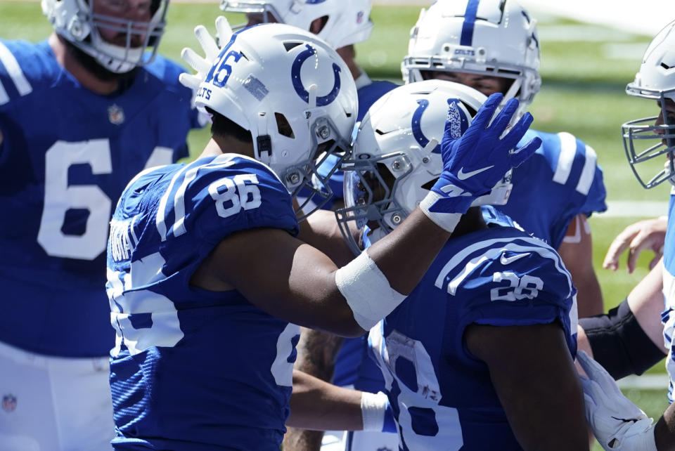 Indianapolis Colts' Jonathan Taylor (28) celebrates with Noah Togiai (86) after running for a touchdown during the first half of an NFL football game against the Minnesota Vikings, Sunday, Sept. 20, 2020, in Indianapolis. (AP Photo/Michael Conroy)