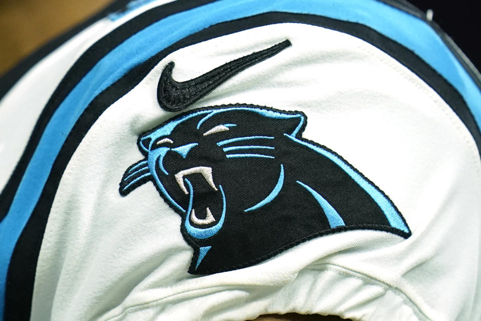 The Carolina Panthers logo and Nike logo are seen in detail on the shoulder of a player after an NFL football game against the <a class="link " href="https://sports.yahoo.com/nfl/teams/houston/" data-i13n="sec:content-canvas;subsec:anchor_text;elm:context_link" data-ylk="slk:Houston Texans;sec:content-canvas;subsec:anchor_text;elm:context_link;itc:0">Houston Texans</a>, Thursday, Sept. 23, 2021, in Houston. (AP Photo/Matt Patterson)