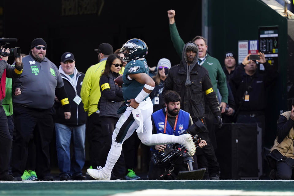 Philadelphia Eagles' Jalen Hurts scores a touchdown during the first half of an NFL football game against the Philadelphia Eagles, Sunday, Dec. 4, 2022, in Philadelphia. (AP Photo/Matt Slocum)