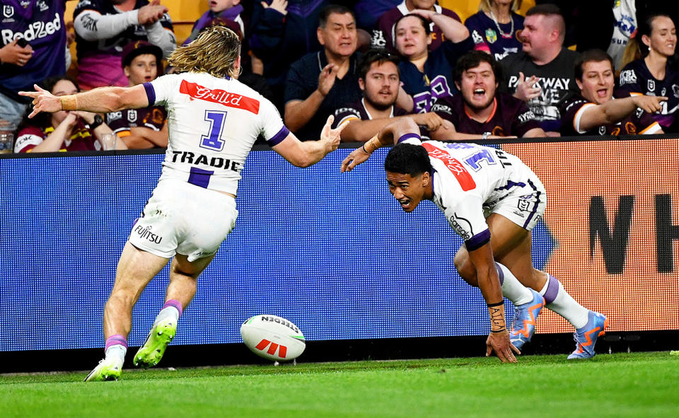Ryan Papenhuyzen and Sualauvi Faalogo, pictured here after a Storm try against the Broncos.