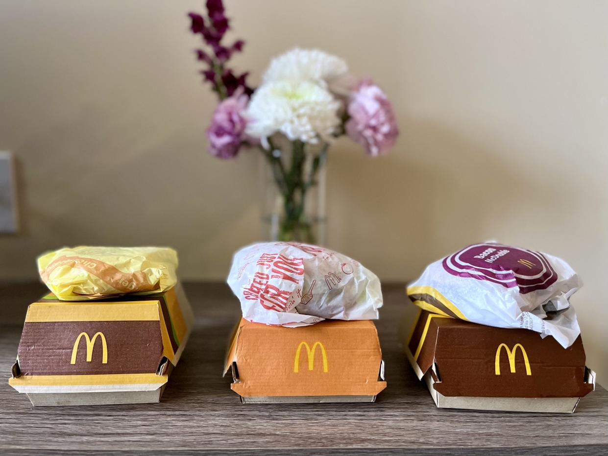 six different mcdonalds burgers in their packaging