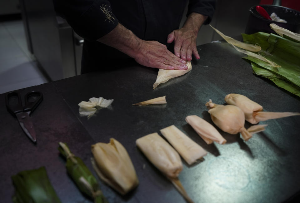 Mexican chef Ricardo Munoz Zurita teaches about the the types of tamales at his kitchen in Mexico City, Wednesday, Jan. 25, 2023. "The popularity of the tamal is so great that I don't think they're going to stop making them in this century because it is not an isolated dish, there is a total tamal culture," Muñoz Zurita said. (AP Photo/Fernando Llano)