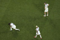 Tyler Adams of the United States, left, DeAndre Yedlin of the United States, Walker Zimmerman of the United States, right, react during the World Cup round of 16 soccer match between the Netherlands and the United States, at the Khalifa International Stadium in Doha, Qatar, Saturday, Dec. 3, 2022. (AP Photo/Hassan Ammar)