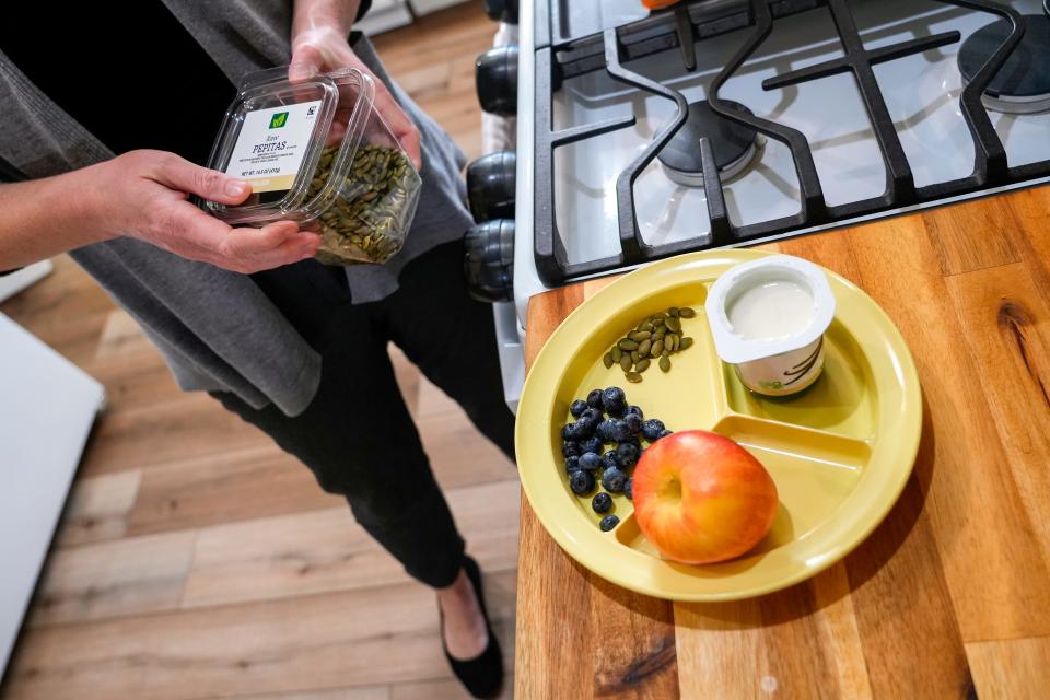 Allison Reynolds, of Ludlow, makes an after-school snack for 3-year-old Missouri on Jan. 17. The costs are covered by a women, infants and children supplemental food benefit, which U.S. Agriculture says is threatened by potential funding cuts.