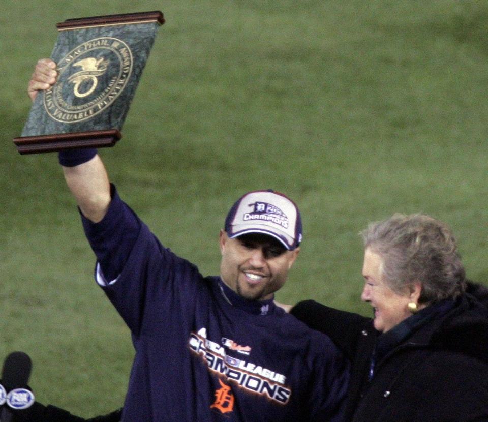 ALCS MVP Placido Polanco shows off his trophy to the fans in Comerica Park to celebrate after winning Game 4 in dramatic fashion and advance to the World Series on Magglio Ordonez's three-run homer on October 14, 2006.