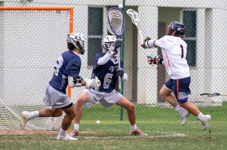 St. Edward's goalkeeper, Liam Murphy, blocks a shot by the Benjamin SchoolÕs Trevor Natalie during the District 8-1A championship on Thursday, April 15, 2021, at St. EdwardÕs School in Vero Beach. St. EdwardÕs won 17-10.