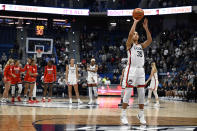 UConn guard Azzi Fudd (35) takes a technical foul shot before game tip off for an administrative technical foul in the first half of an NCAA college basketball game, Wednesday, Nov. 8, 2023, in Hartford, Conn. (AP Photo/Jessica Hill)