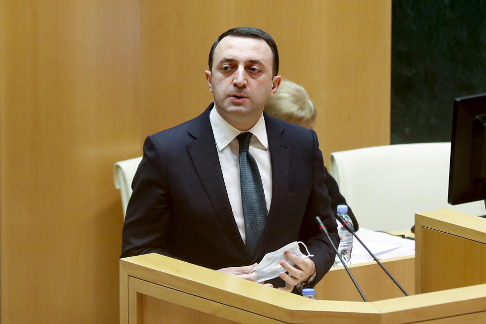 Georgian Dream party Prime minister nominee Irakli Garibashvili speaks at the Georgian Parliament in Tbilisi, Georgia, Monday, Feb. 22, 2021. The parliament in ex-Soviet nation Georgia has voted to appoint a new prime minister and Cabinet after Giorgi Gakharia resigned last week. The lawmakers voted 89:2 for Irakli Garibashvili and his cabinet. (AP Photo/Shakh Aivazov)