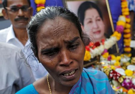 A supporter of Tamil Nadu Chief Minister Jayalalithaa Jayaraman cries as she attends a prayer ceremony at the AIADMK party office in Mumbai, India, December 6, 2016. REUTERS/Danish Siddiqui