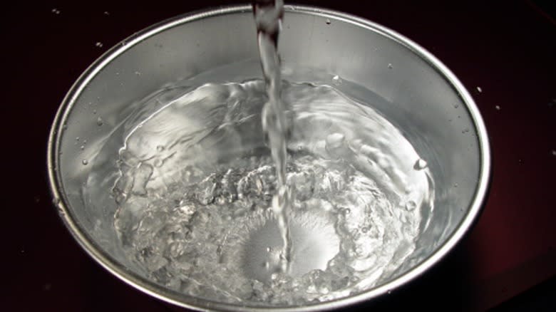 Pouring water into bowl