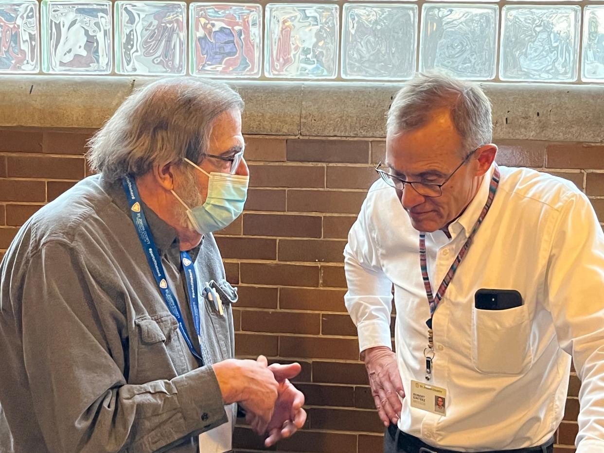 Dr. Tom Felger, left, St. Joseph County Health Officer from 2010-2014, speaks with Dr. Bob Einterz on March 23, 2023, at IUSB’s Civil Rights Heritage Center, after Einterz gave a farewell talk following his resignation from the post in late December 2022.
