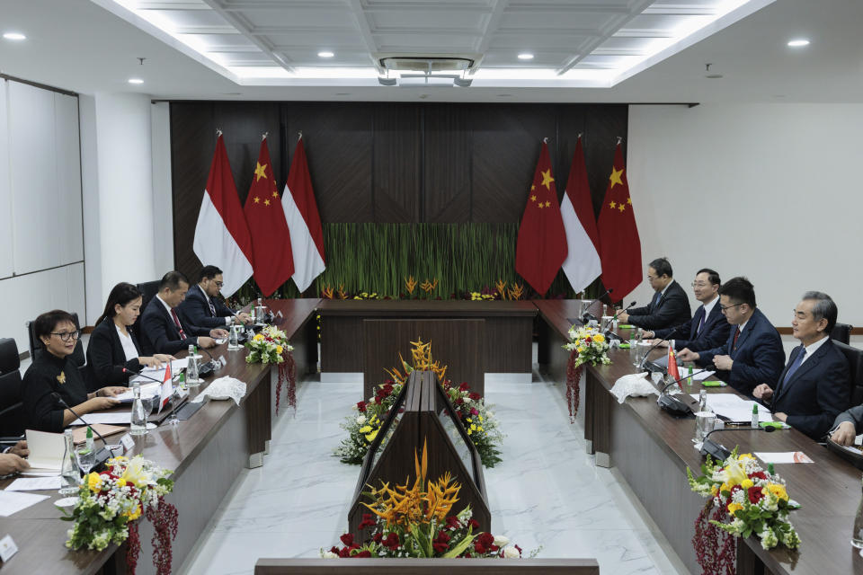 Indonesian Foreign Minister Retno Marsudi, left, speaks during their bilateral meeting with Chinese Foreign Minister Wang Yi, right, in Jakarta, Indonesia, Thursday, April 18, 2024. (Yasuyoshi Chiba/Pool Photo via AP)