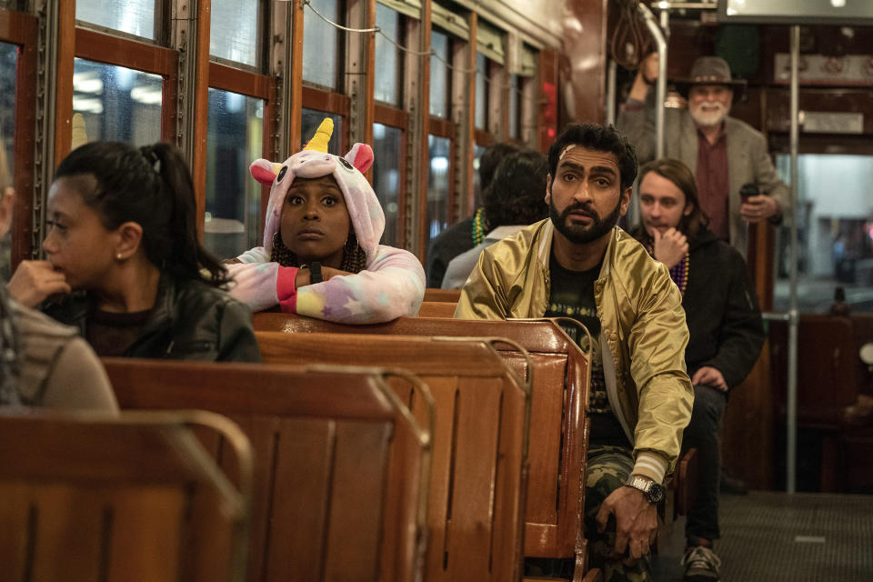 This image released by Netflix shows Issa Rae as Leilani, left, and Kumail Nanjiana as Jibran in a scene from "The Lovebirds." (Skip Bolen/Netflix via AP)