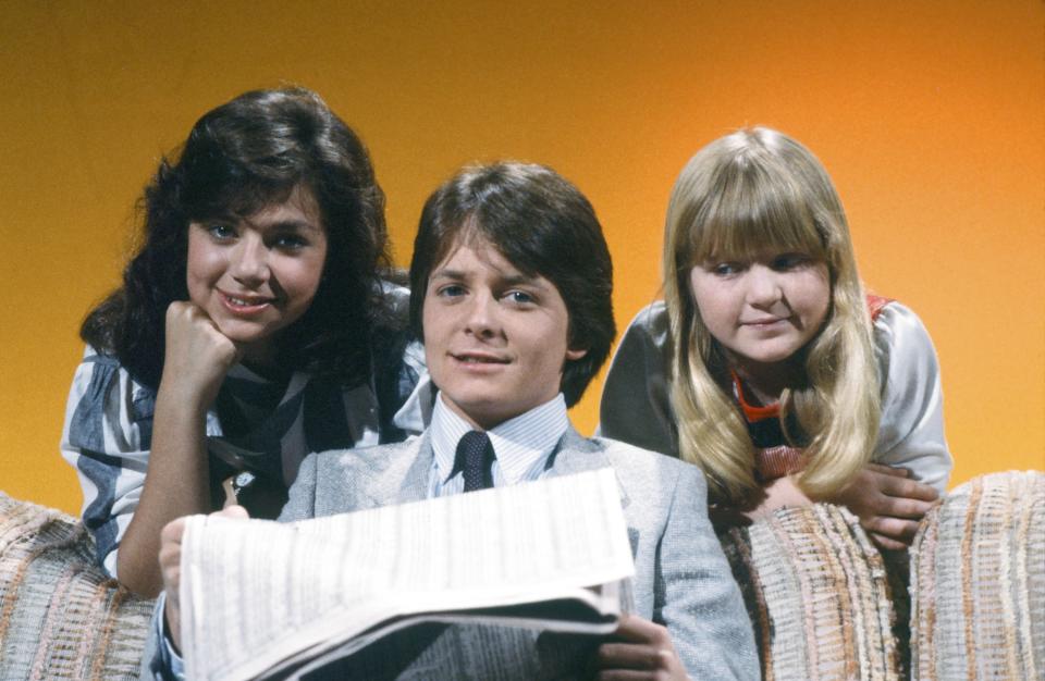 From left, Justine Bateman, Michael J. Fox and Tina Yothers in a promotional photo for "Family Ties," which aired for seven seasons on NBC. (Photo: NBC via Getty Images)