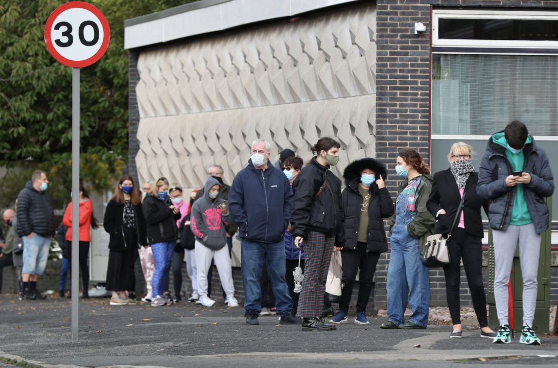 People at a test centre in Liverpool, which has the country's third-highest infection rate.