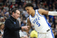 Duke coach Mike Krzyzewski talks to forward Paolo Banchero during the second half of the team's NCAA college basketball game against Gonzaga on Friday, Nov. 26, 2021, in Las Vegas. (AP Photo/Ellen Schmidt)