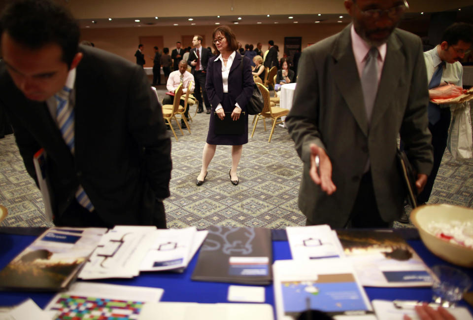 People participate in a job fair in New York June 11, 2012. REUTERS/Eric Thayer (UNITED STATES - Tags: BUSINESS EMPLOYMENT)