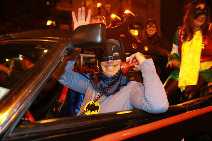 <p>Batman answers the phone while driving the Batmobile in the 44th annual Village Halloween Parade in New York City on Oct. 31, 2017. (Photo: Gordon Donovan/Yahoo News) </p>